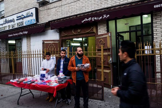 Men distribute literature outside the Islamic Society of Bay Ridge on a recent Saturday afternoon